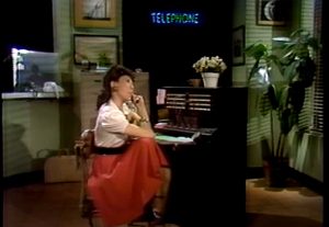 photo of Lily Tomlin playing the part of Ernestine, the Telephone Operator from Saturday Night Live (SNL)